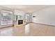 Inviting living room with fireplace, tiled floors, and a view to the kitchen at 10421 E Silvertree Dr, Sun Lakes, AZ 85248