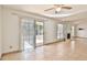 Tiled living room featuring a fireplace and sliding doors for outdoor access at 10421 E Silvertree Dr, Sun Lakes, AZ 85248