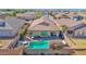 An aerial view of a backyard featuring a private pool, patio, and lush landscaping in a Gathering-friendly neighborhood at 10942 E Sonrisa Ave, Mesa, AZ 85212