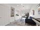 Bright living room with built-in shelves and cabinets, and sliding glass doors to backyard at 10942 E Sonrisa Ave, Mesa, AZ 85212