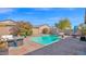 Inviting backyard pool area with lounge furniture and blossoming landscaping at 10942 E Sonrisa Ave, Mesa, AZ 85212