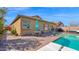 Inviting pool area with patio, landscaping, and comfortable seating arrangement at 10942 E Sonrisa Ave, Mesa, AZ 85212