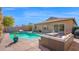 Backyard pool and patio with comfortable outdoor seating, great for relaxation and gatherings at 10942 E Sonrisa Ave, Mesa, AZ 85212