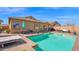 Beautiful backyard pool with shaded seating and lush landscaping; perfect for outdoor enjoyment at 10942 E Sonrisa Ave, Mesa, AZ 85212