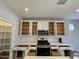 Bright kitchen features white cabinets, stainless steel appliances, and a pantry, perfect for cooking and storage at 10968 W Baden St, Avondale, AZ 85323