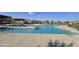 Bright community pool with lounge chairs and umbrellas offers a refreshing outdoor retreat at 10968 W Baden St, Avondale, AZ 85323