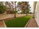 Backyard featuring low-maintenance desert landscaping and turf grass offering a private outdoor space at 1114 S Presidio Ave, Gilbert, AZ 85233