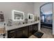 Elegant bathroom with double sinks, framed mirrors, and well-lit vanity at 1114 S Presidio Ave, Gilbert, AZ 85233