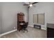 Cozy bedroom featuring a carpeted floor, desk, and natural light through window blinds at 1114 S Presidio Ave, Gilbert, AZ 85233