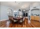 Inviting formal dining room with hardwood floors and an elegant chandelier at 1114 S Presidio Ave, Gilbert, AZ 85233