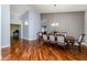 Bright dining room with hardwood floors, a modern chandelier, and neutral-colored walls at 1114 S Presidio Ave, Gilbert, AZ 85233