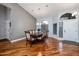 Inviting dining area featuring hardwood floors, a modern chandelier, and access to other rooms at 1114 S Presidio Ave, Gilbert, AZ 85233