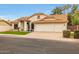 Charming single-story home with tile roof, three car garage, and green lawn at 1114 S Presidio Ave, Gilbert, AZ 85233