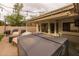 Covered patio area features an outdoor kitchen, hot tub and ample room for dining and relaxing at 1114 S Presidio Ave, Gilbert, AZ 85233