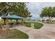 Outdoor picnic area with grills, tables, and lake views perfect for community gatherings and relaxing by the water at 1114 S Presidio Ave, Gilbert, AZ 85233