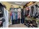 Organized walk-in closet featuring ample storage, hanging rods, and shelving for clothes, shoes and accessories at 1114 S Presidio Ave, Gilbert, AZ 85233