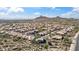 Expansive aerial view of a desert community, highlighting mountain views and neighborhood layout at 11152 E White Feather Ln, Scottsdale, AZ 85262