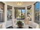 Cozy breakfast nook with desert views from bright windows creating a peaceful setting at 11152 E White Feather Ln, Scottsdale, AZ 85262