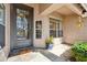 Elegant front entrance with an ornate iron door and tiled porch that welcomes visitors at 11152 E White Feather Ln, Scottsdale, AZ 85262