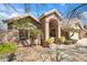 Inviting home exterior with well-maintained landscaping and a charming tiled roof at 11152 E White Feather Ln, Scottsdale, AZ 85262