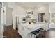 Modern kitchen with stainless steel appliances, a center island, and sleek white cabinetry at 11152 E White Feather Ln, Scottsdale, AZ 85262