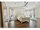 Spacious main bedroom featuring a vaulted ceiling, wood-look flooring, and large windows offering plenty of natural light at 11152 E White Feather Ln, Scottsdale, AZ 85262