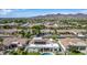 An aerial view of the neighborhood with stunning mountain views in the background at 11343 E Appaloosa Pl, Scottsdale, AZ 85259