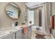 Bathroom featuring modern fixtures, neutral tiling, and decorative artwork at 11343 E Appaloosa Pl, Scottsdale, AZ 85259