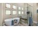 Bright bathroom featuring a soaking tub, glass shower, and wood look flooring at 11343 E Appaloosa Pl, Scottsdale, AZ 85259