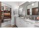 Bright bathroom with dual sinks, granite counters, and decorative pendant lights at 11343 E Appaloosa Pl, Scottsdale, AZ 85259