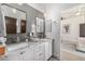 Bright bathroom with dual sinks, granite counters, and decorative pendant lights at 11343 E Appaloosa Pl, Scottsdale, AZ 85259