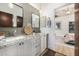 Bathroom featuring dual sinks with granite countertops and modern decor at 11343 E Appaloosa Pl, Scottsdale, AZ 85259