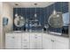 Beautiful bathroom with dual sinks, modern blue backsplash, granite countertops, and pendant lighting at 11343 E Appaloosa Pl, Scottsdale, AZ 85259