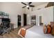 Stylish bedroom with a ceiling fan and ensuite at 11343 E Appaloosa Pl, Scottsdale, AZ 85259