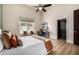 Contemporary bedroom with a ceiling fan and lots of light at 11343 E Appaloosa Pl, Scottsdale, AZ 85259