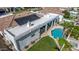 Aerial view showcasing lush backyard, rooftop solar panels, and outdoor living space at 11343 E Appaloosa Pl, Scottsdale, AZ 85259