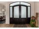 Elegant entrance with glass double doors and interior view at 11343 E Appaloosa Pl, Scottsdale, AZ 85259