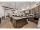 Beautiful kitchen featuring dual islands, designer lighting, and stainless steel appliances at 11343 E Appaloosa Pl, Scottsdale, AZ 85259