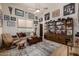 Living room with neutral decor, sports memorabilia, comfortable seating, and stylish accents at 11343 E Appaloosa Pl, Scottsdale, AZ 85259