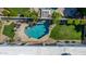 Aerial view of a backyard pool with desert landscaping, spa, and an outdoor kitchen area at 11343 E Appaloosa Pl, Scottsdale, AZ 85259