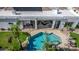 Aerial view of a pool with covered patio seating and lush green landscaping at 11343 E Appaloosa Pl, Scottsdale, AZ 85259