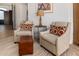 Cozy sitting area featuring two comfortable chairs, throw pillows, a decorative rug, and an accent table with lamp at 11343 E Appaloosa Pl, Scottsdale, AZ 85259