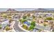 Picturesque aerial view of a neighborhood, featuring well-maintained homes with lush trees and a sparkling community pool at 114 E Garfield St, Tempe, AZ 85288