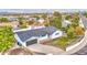 Aerial view of a charming single-Gathering home with a driveway, lush green lawn, and a neatly kept landscape at 114 E Garfield St, Tempe, AZ 85288