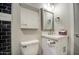 A clean and modern bathroom featuring a white vanity and chrome finishes at 114 E Garfield St, Tempe, AZ 85288