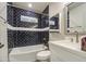 Beautiful bathroom featuring navy blue subway tile in the shower/tub and white vanity at 114 E Garfield St, Tempe, AZ 85288