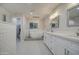 Bright bathroom with a modern standalone tub, dual vanities, and striking hexagonal tile flooring at 114 E Garfield St, Tempe, AZ 85288