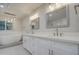 Bright bathroom with a modern standalone tub, dual vanities, and striking hexagonal tile flooring at 114 E Garfield St, Tempe, AZ 85288