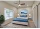 Stylishly furnished bedroom with large window, ceiling fan, and sliding barn door at 114 E Garfield St, Tempe, AZ 85288