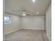 Spacious bedroom featuring neutral carpeting, ceiling fan, and ample natural light at 114 E Garfield St, Tempe, AZ 85288